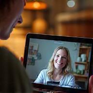 Person watching online lesson on a tablet.