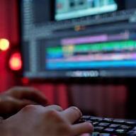 Hands using video editing software.